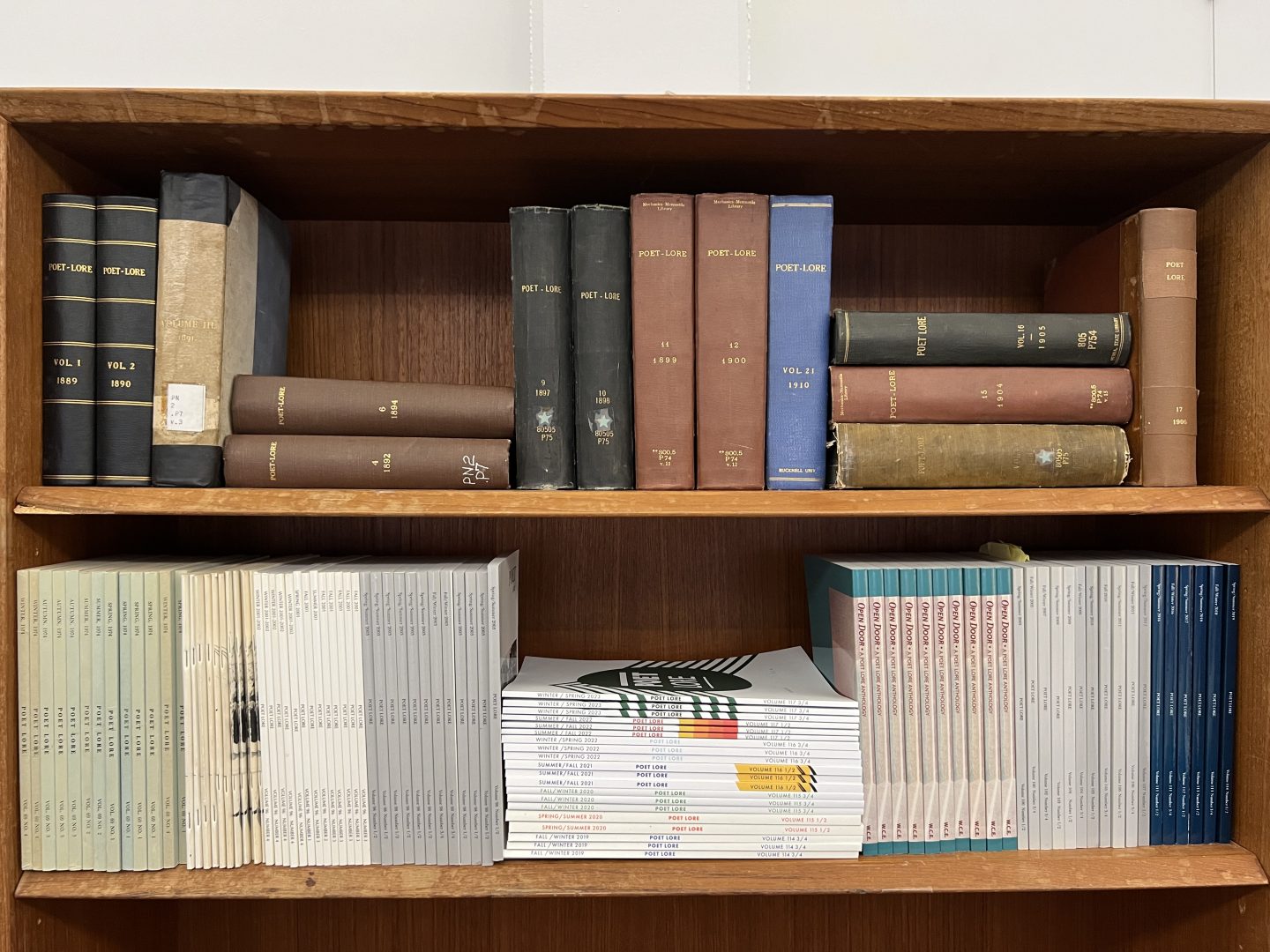A shelf with old books.